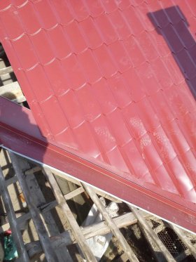 Metal tile roofing system